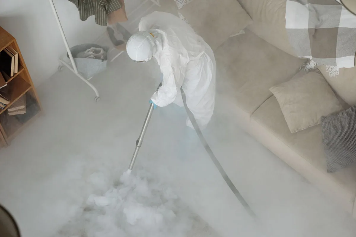 Biohazard cleanup technician in protective equipment, Parksdale, CA